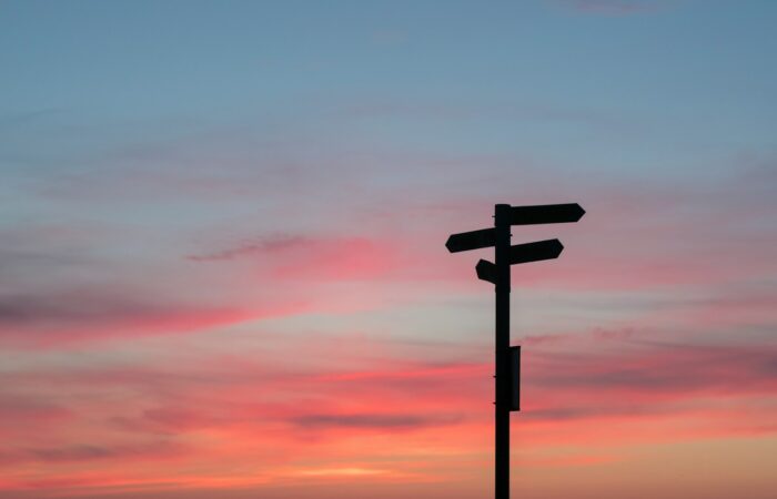 silhouette of road signage during golden hour