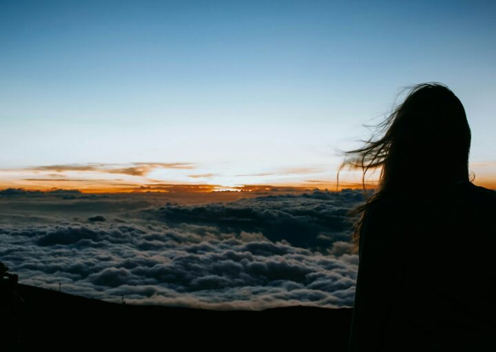 person overlooking clouds