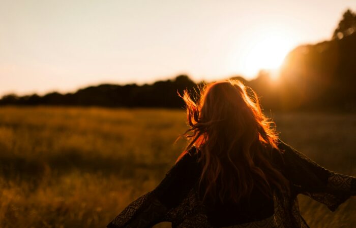 woman standing on grass field