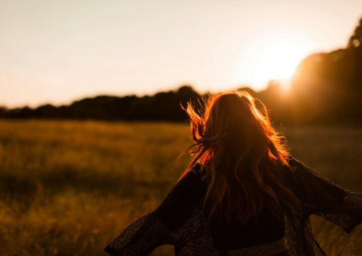 woman standing on grass field