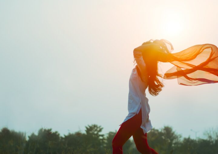 woman spreading hair at during sunset