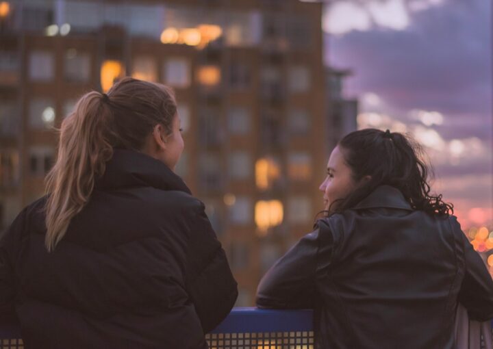 two women standing near railings