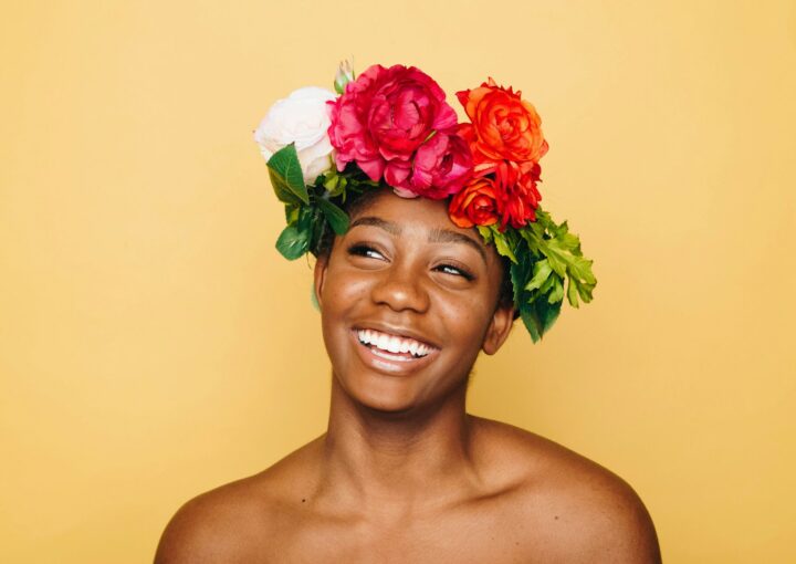 woman smiling wearing flower crown