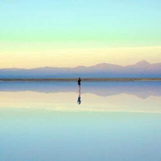 person standing near body of water during daytime