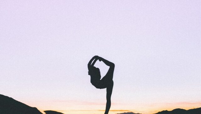 woman standing with her one leg